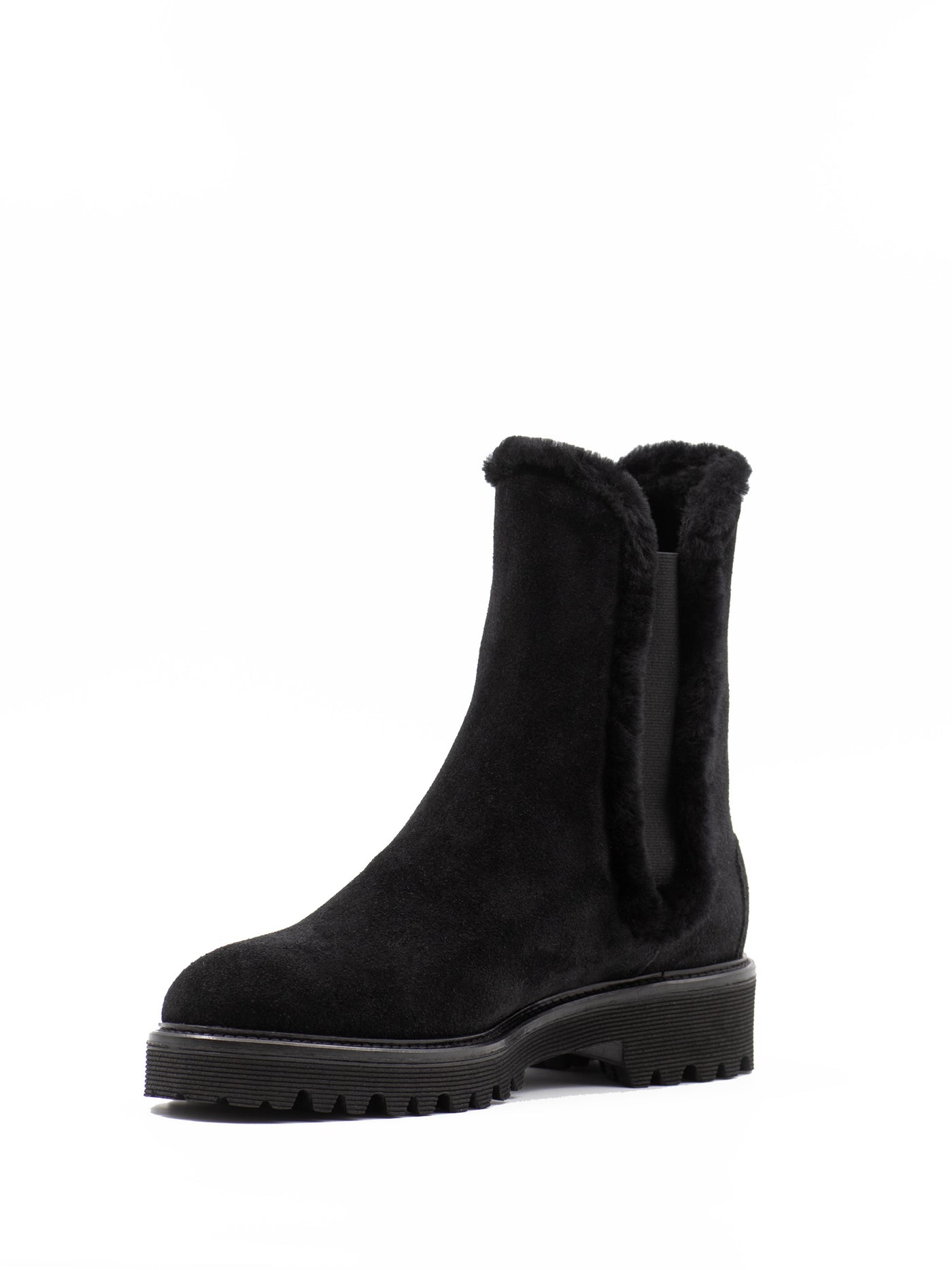 Black Chelsea boots with fur lining. 