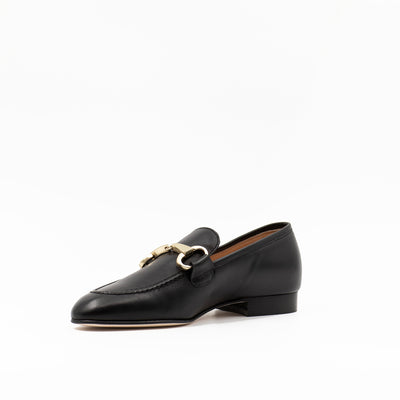 Black leather loafer with gold buckle